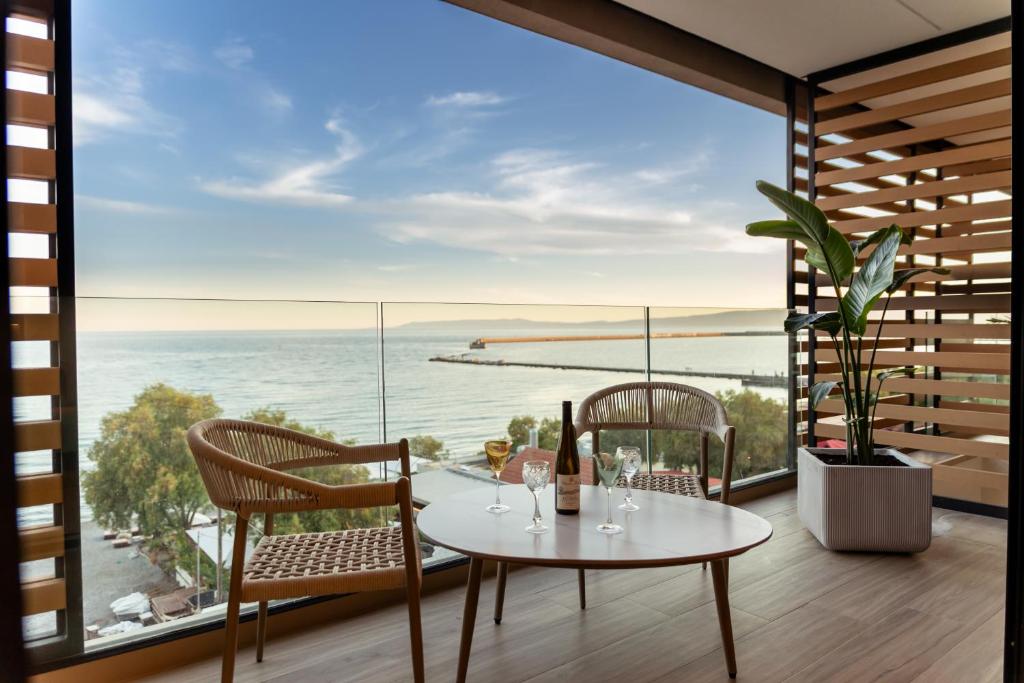 a dining room with a view of the ocean at TAYS Hotel in Kalamata