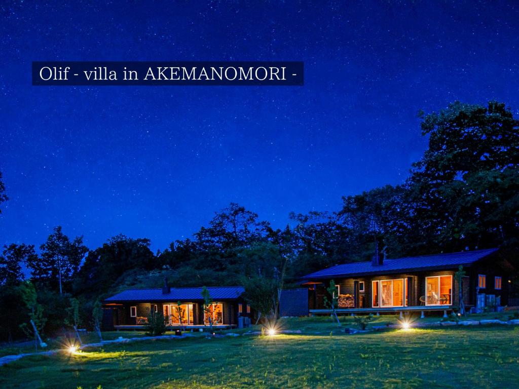 a house at night with the words off villa in aernessowment at FOREAT akemanomori in Daisen