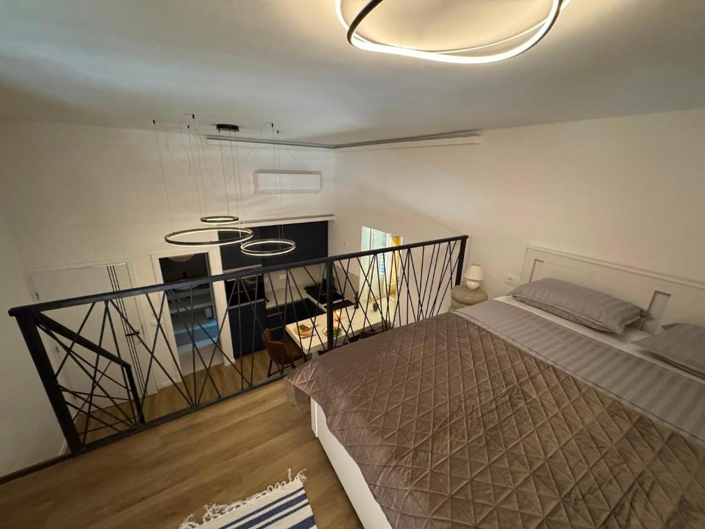 a bedroom with a bed in a room at Peregrino Residence in Punat