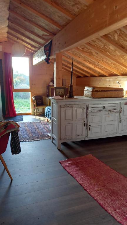 a living room with a white dresser in a cabin at Mont Blanc in Meyrals