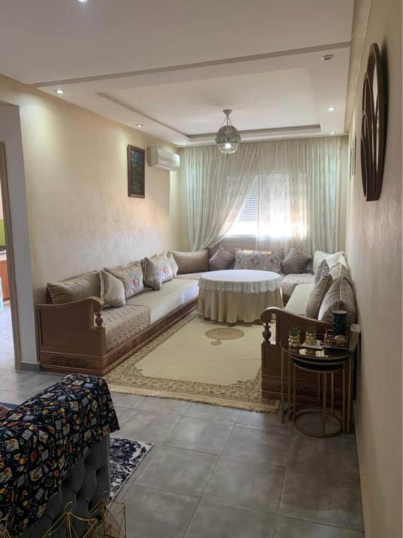 a living room with a couch and a table at Atlas Nest in Beni Mellal