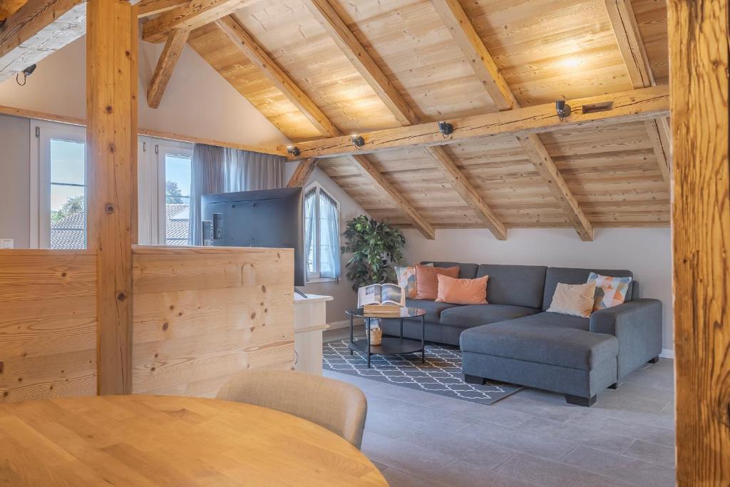 a living room with a couch and a table at Buche in Interlaken