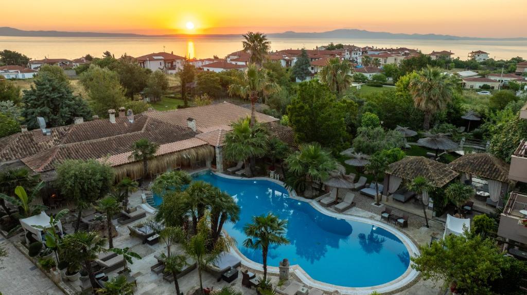 an aerial view of a resort with a pool at Achtis Hotel in Afitos
