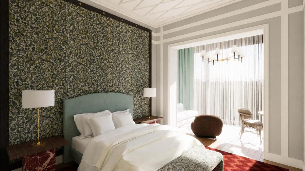 a bedroom with a bed and a window and a chair at Hotel Club 29 in Barcelona
