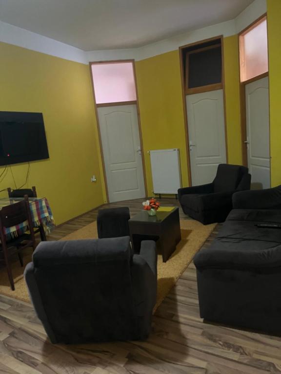 a living room with couches and a flat screen tv at NENSI in Prokuplje