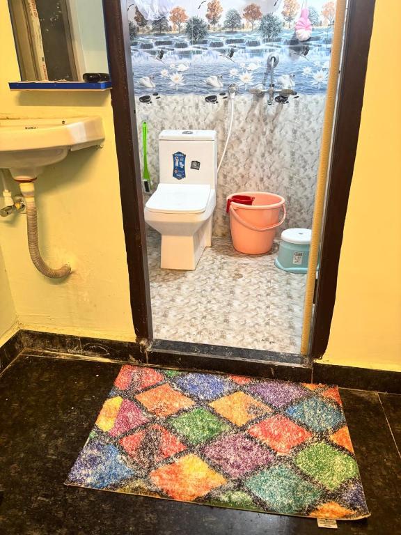 a bathroom with a toilet and a sink at Lara Homestay 1bhk Begumpet in Hyderabad