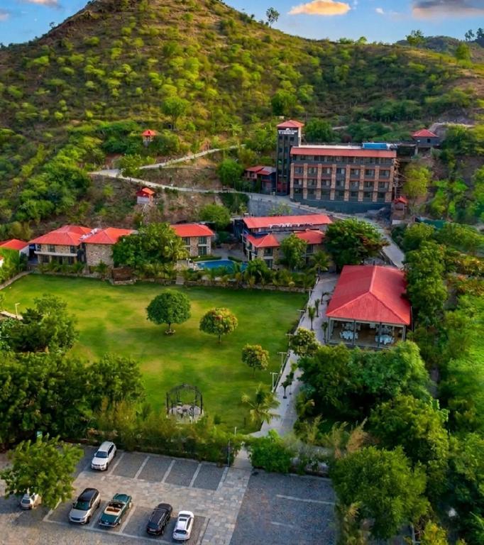 an aerial view of a campus with a mountain at The Divine Hills Resort Suites with Private Pool Near IIM Udaipur in Nāi