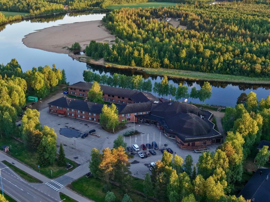 an aerial view of a building next to a lake at Hotel Ivalo in Ivalo