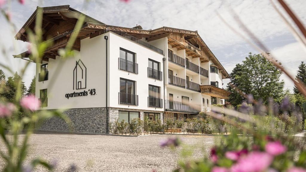 a building with a sign on the side of it at apartments '43 in Reith im Alpbachtal