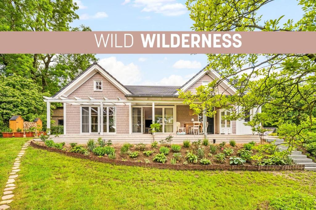 a home with the words wild wilderness written onscreen at Wild Wilderness in Schaalby