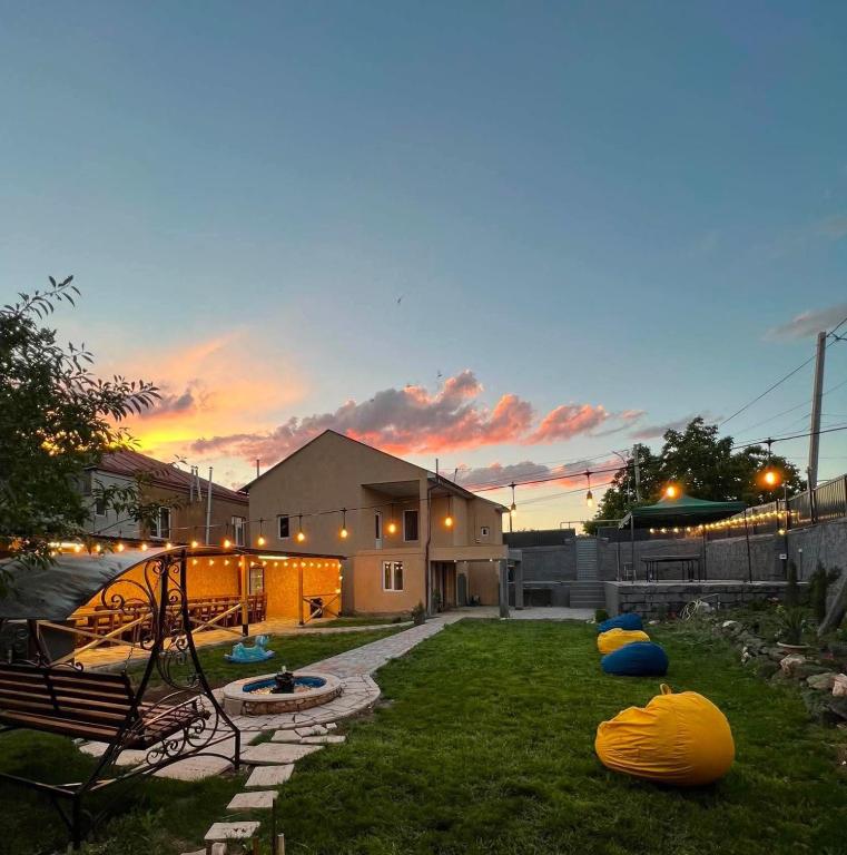 a backyard with inflated objects on the grass at Ohanavan Garden Guesthouse in Oganavan