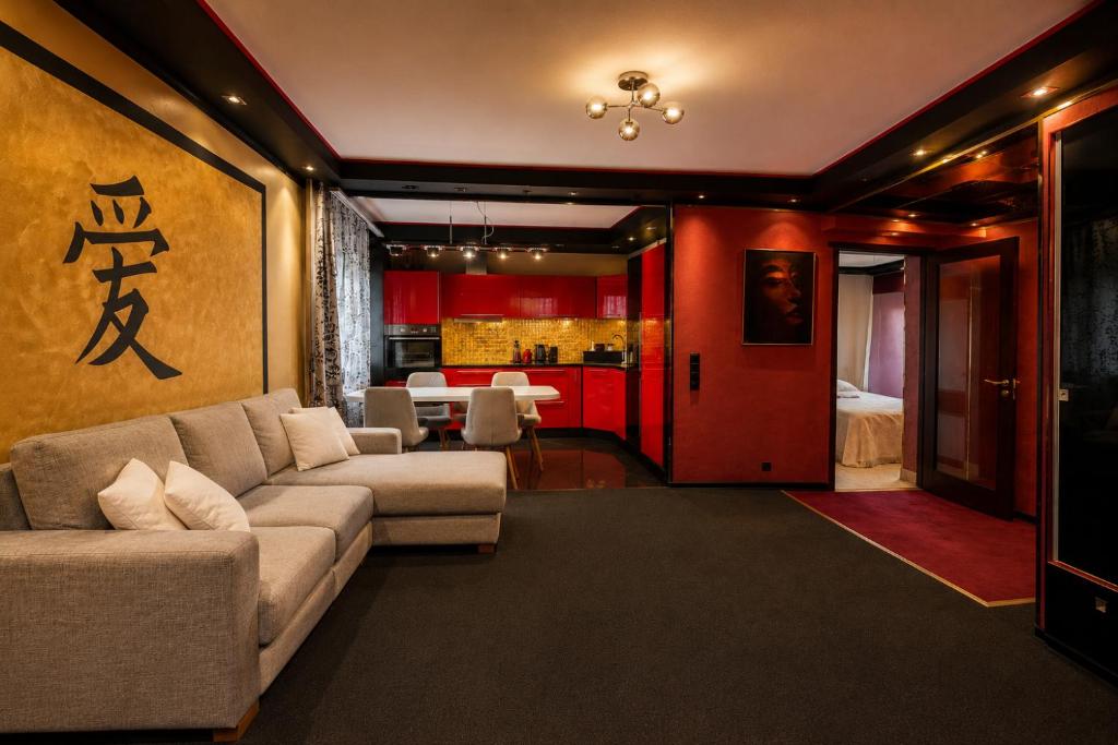 a living room with a couch and a table at Aiavilja Red Pearl Apartment in Paide