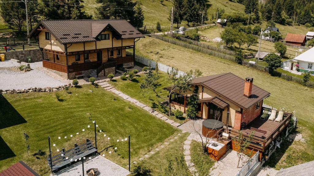 an aerial view of a house with a yard at Cabana Todireni Vatra Dornei in Vatra Dornei