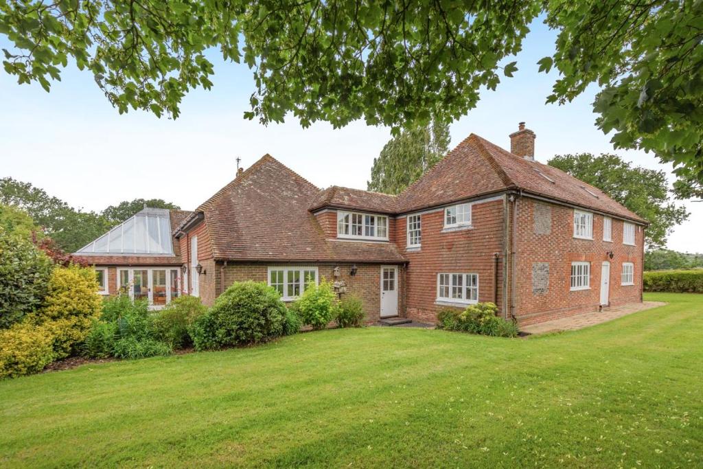 a large brick house with a large yard at 5 Bed in Magham Down oc-sx942 in Hailsham