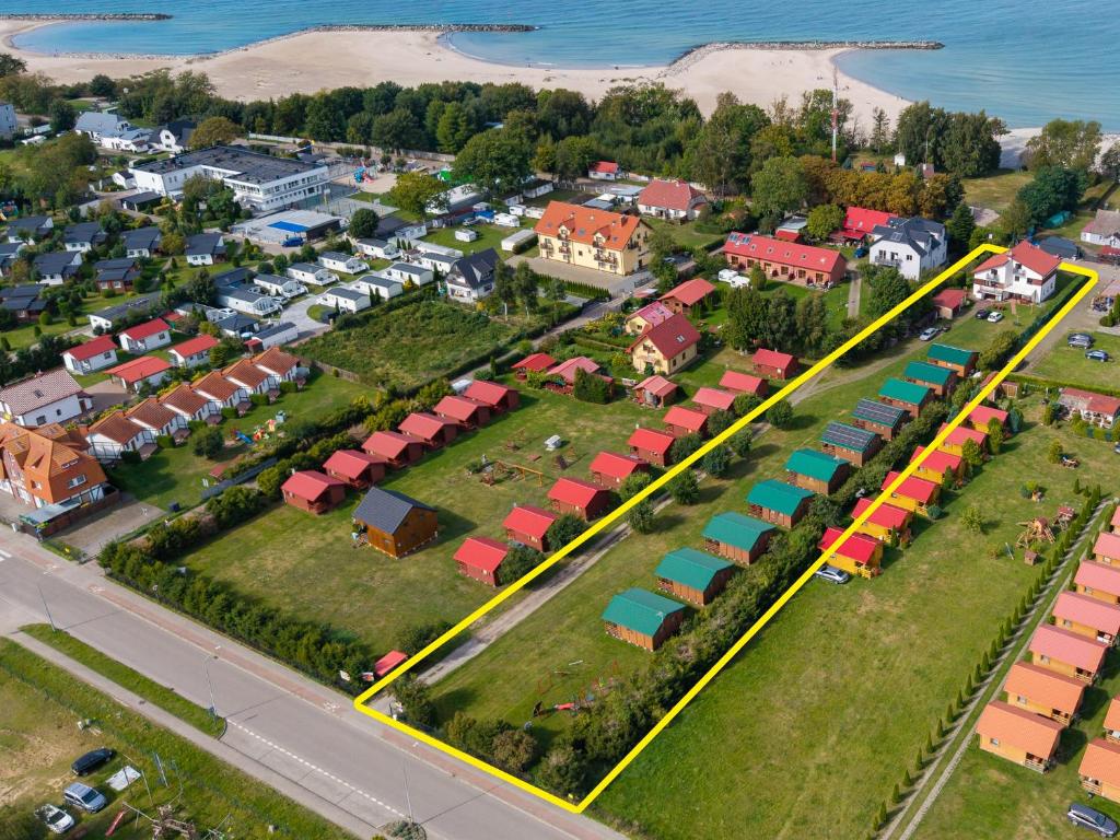 an aerial view of a town with houses and a road at Domki i pokoje nad morzem U Izy Jarosławiec in Jarosławiec