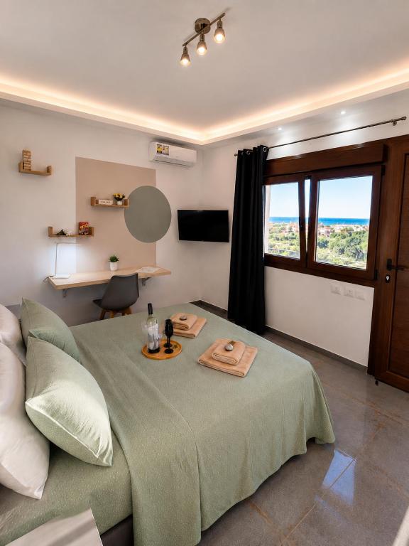 a bedroom with a bed with a tray on it at THEASIS 5 luxury studio with sea view in Neos Marmaras