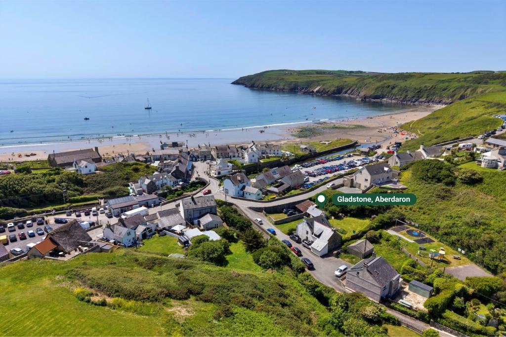 an aerial view of a small town next to a beach at Finest Retreats - Gladstone in Aberdaron
