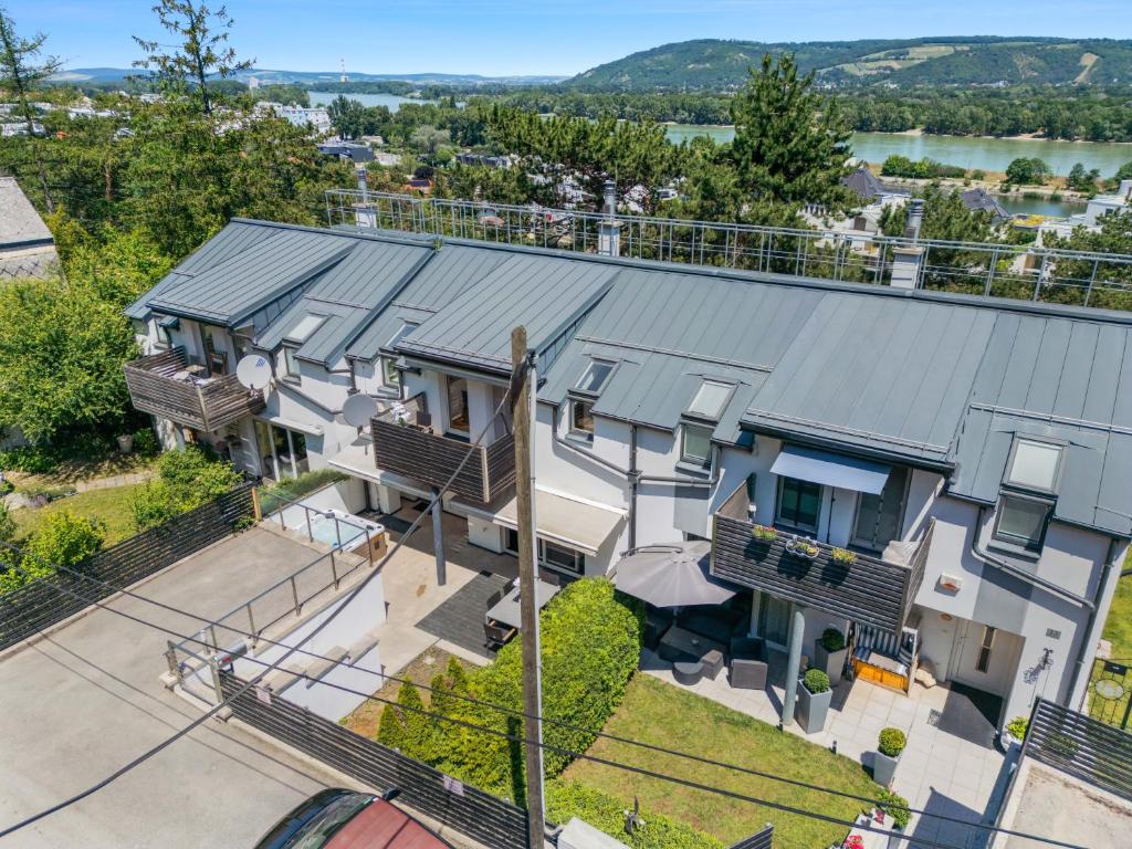 an aerial view of a house with a metal roof at Villa Donau - Sauna & Whirlpool in Vienna