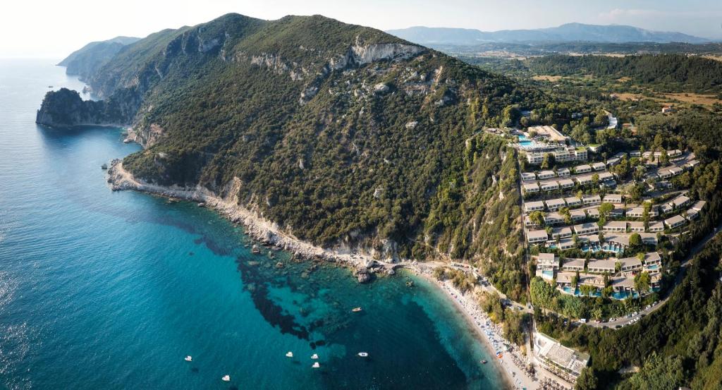 an aerial view of a beach on a mountain at Atlantica Grand Mediterraneo Resort - Adults Only in Kompítsion