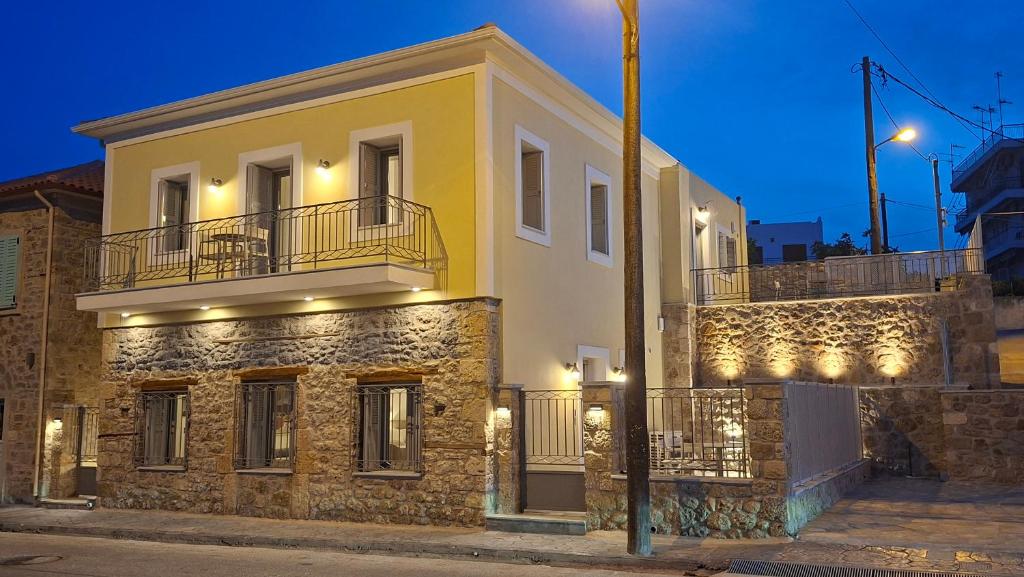 a building with lights on the side of it at Thalassa Seaside Apartments in Sikéa