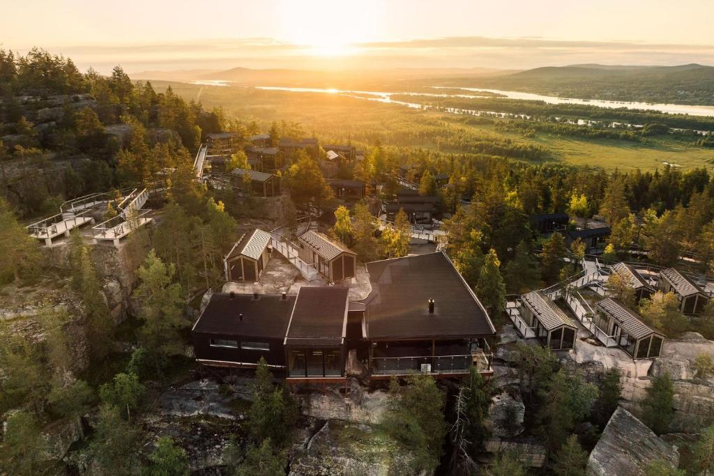 an aerial view of a house in a forest at Lapland View Lodge in Övertorneå
