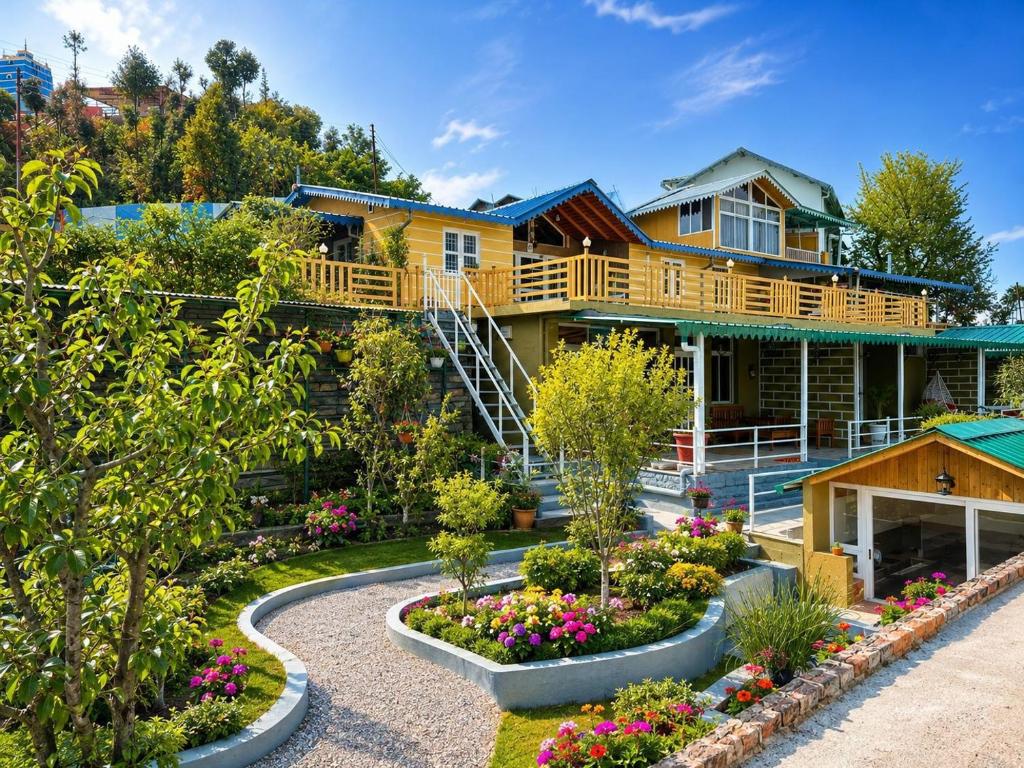 a house with a garden in front of it at The Hills Boho in Mukteshwar