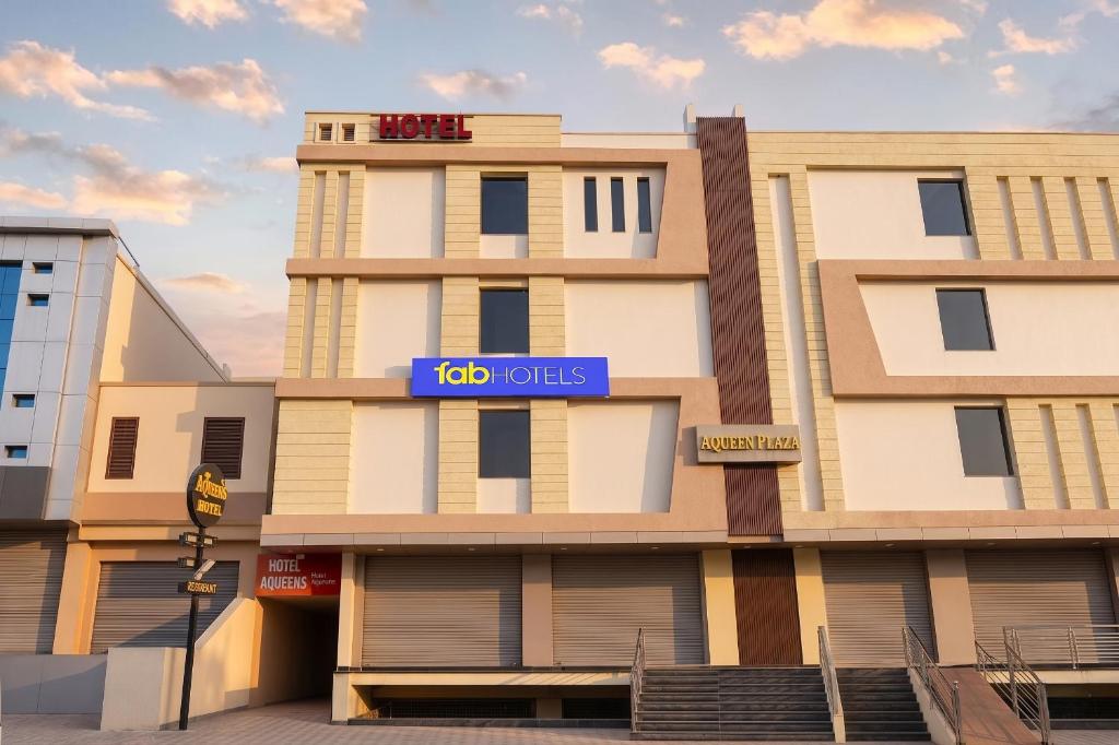a building with a sign that reads hotels at FabHotel Aqueens Plaza - Near Jawahar Circle, Patrika Gate in Siroli