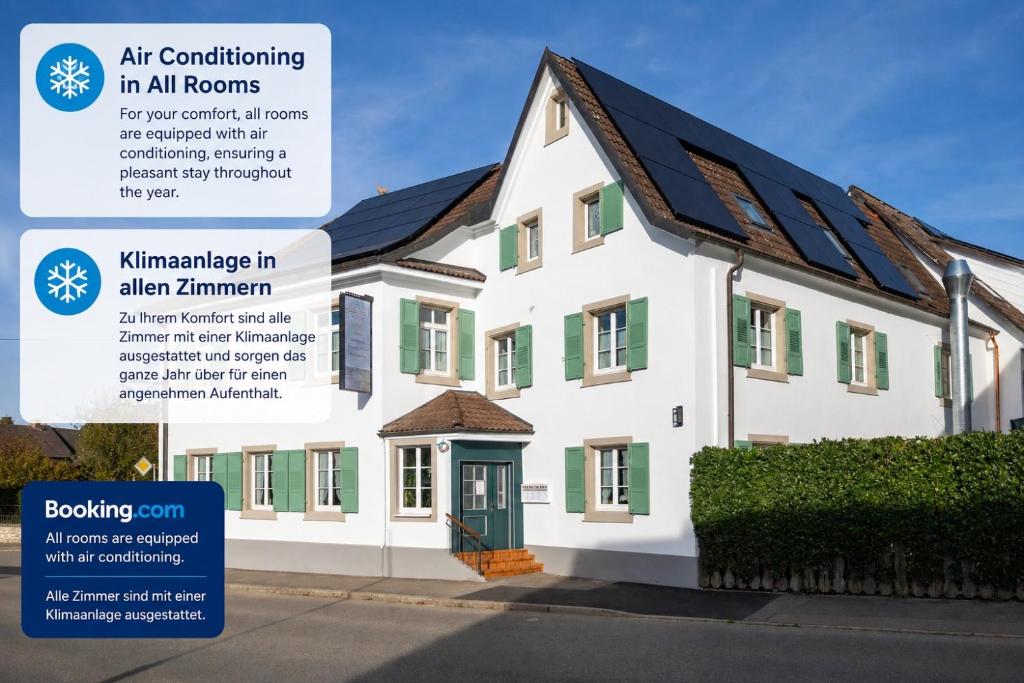 an advertisement for a house with solar panels on it at Gasthof Engel in Müllheim