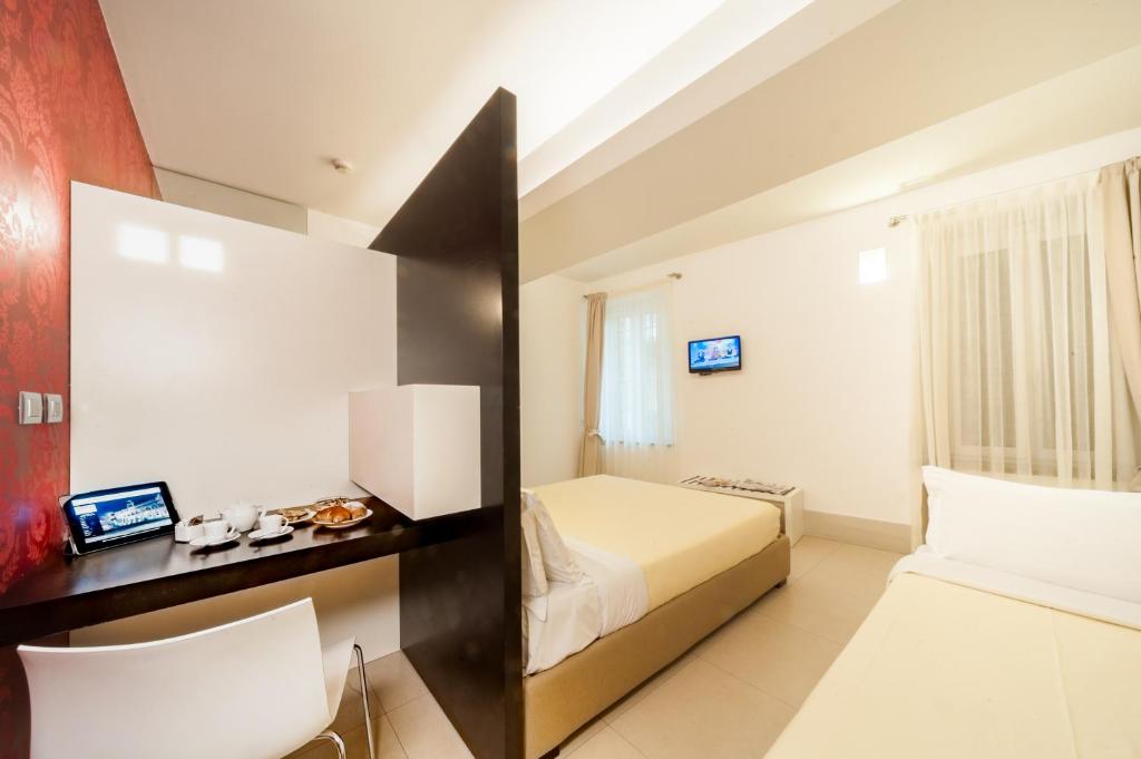 Postel nebo postele na pokoji v ubytování Savoy Hotel