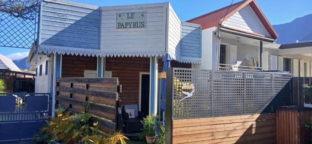 a house with a sign that reads fire repairs at Le Papyrus in Cilaos