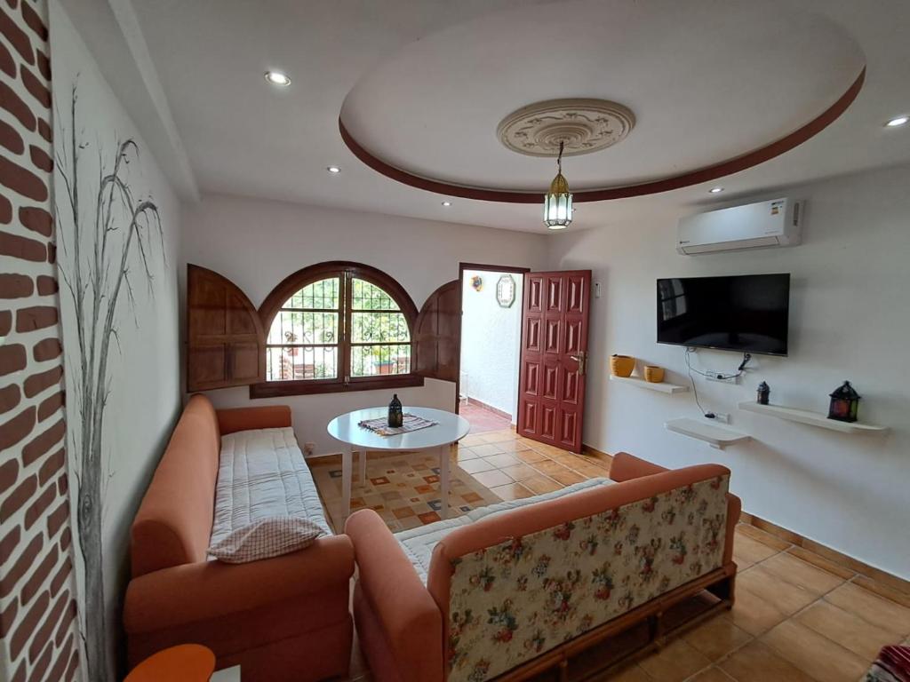 a living room with a couch and a table at Dar YLA in Tétouan