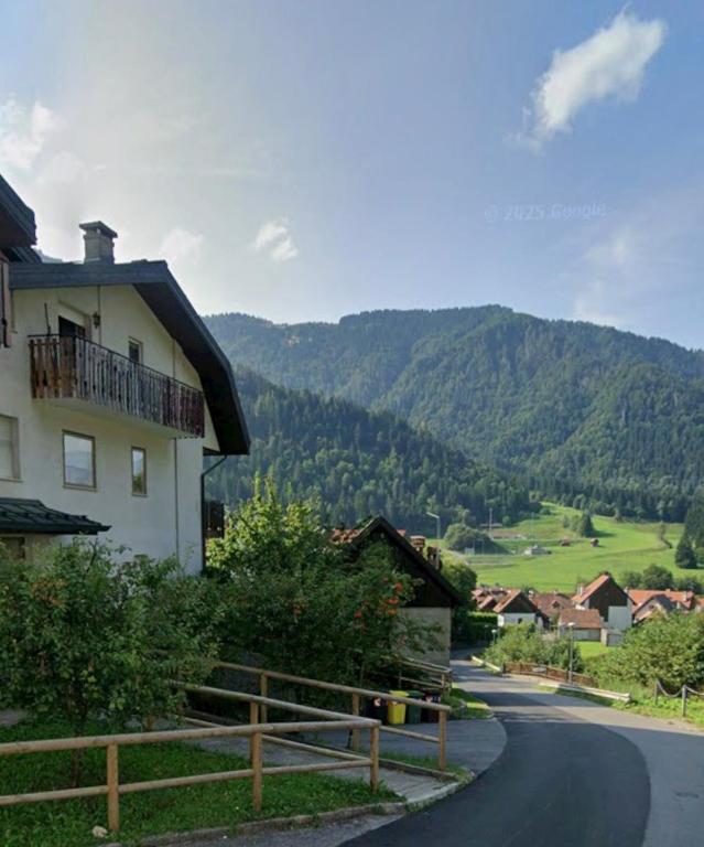 a house on the side of a road with a mountain at Nuvola in Ravascletto