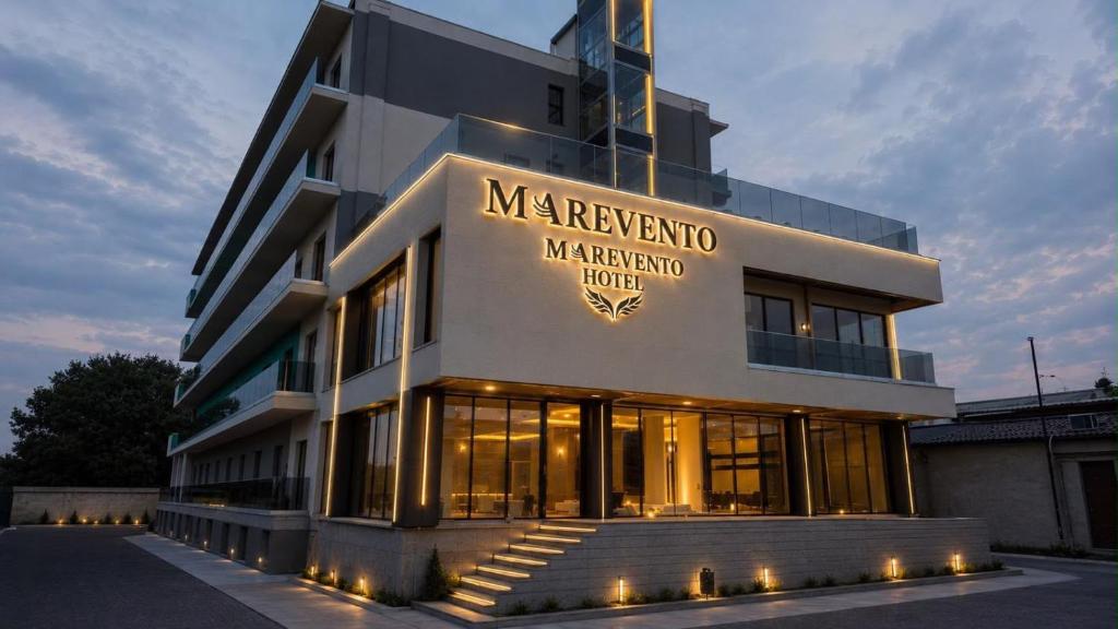 a building with a sign on the front of it at Marevento Hotel in Costinesti