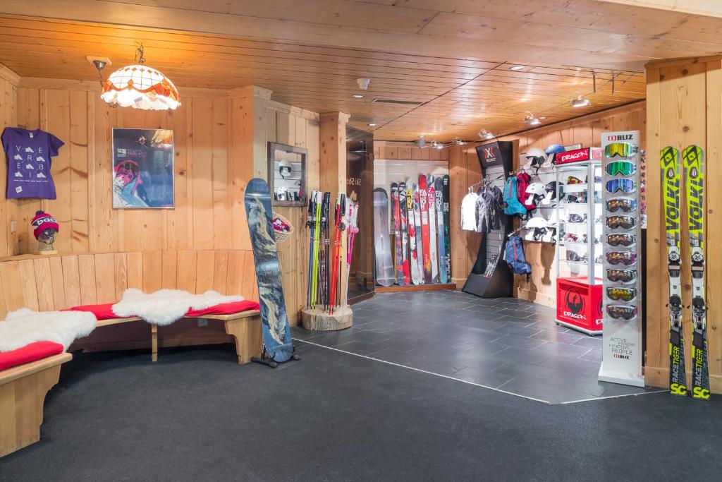 a room with a bunch of skis in it at Hotel Montpelier in Verbier