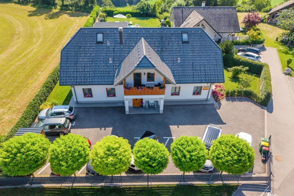 an aerial view of a house with a lot of trees at Apartments Roberta in Bled
