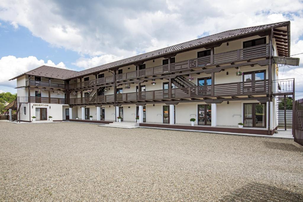 a large white building with a balcony at Serenity in Solotvyno