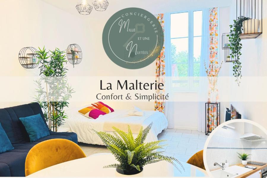 a living room with a bed and a couch at La Malterie - Machine à laver & WiFi in La Chapelle-Saint-Luc