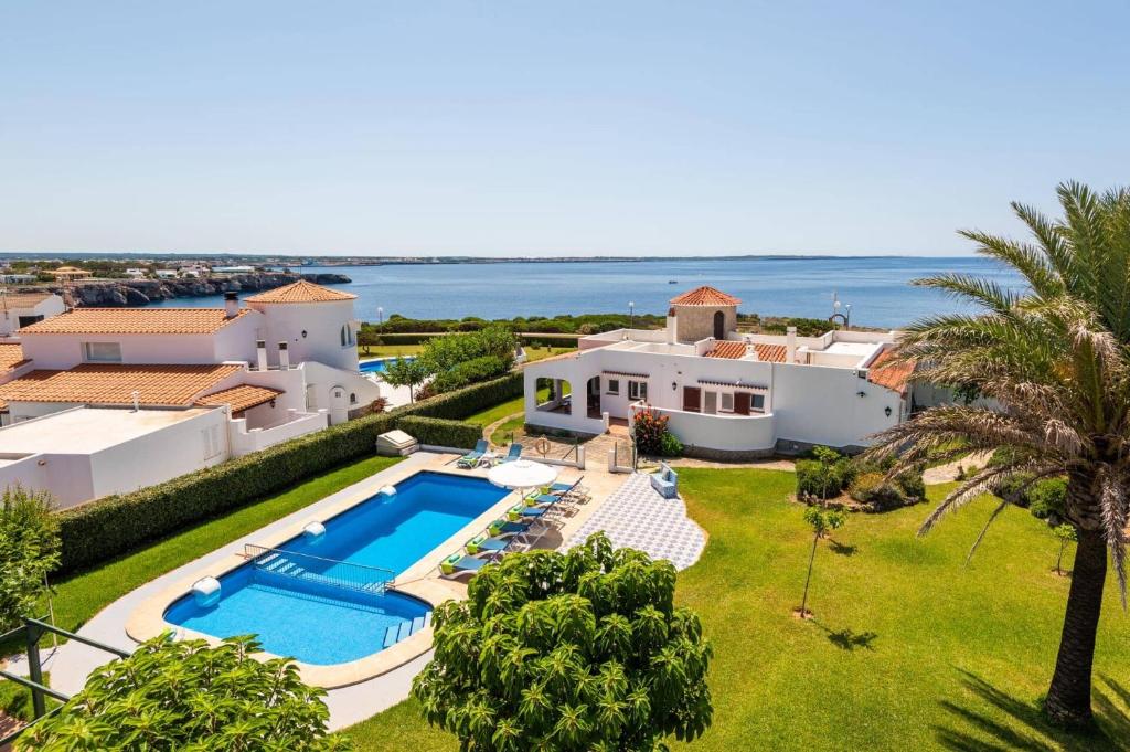 an aerial view of a villa with a swimming pool at Villa Mercedes by Villa Plus in Cala en Forcat