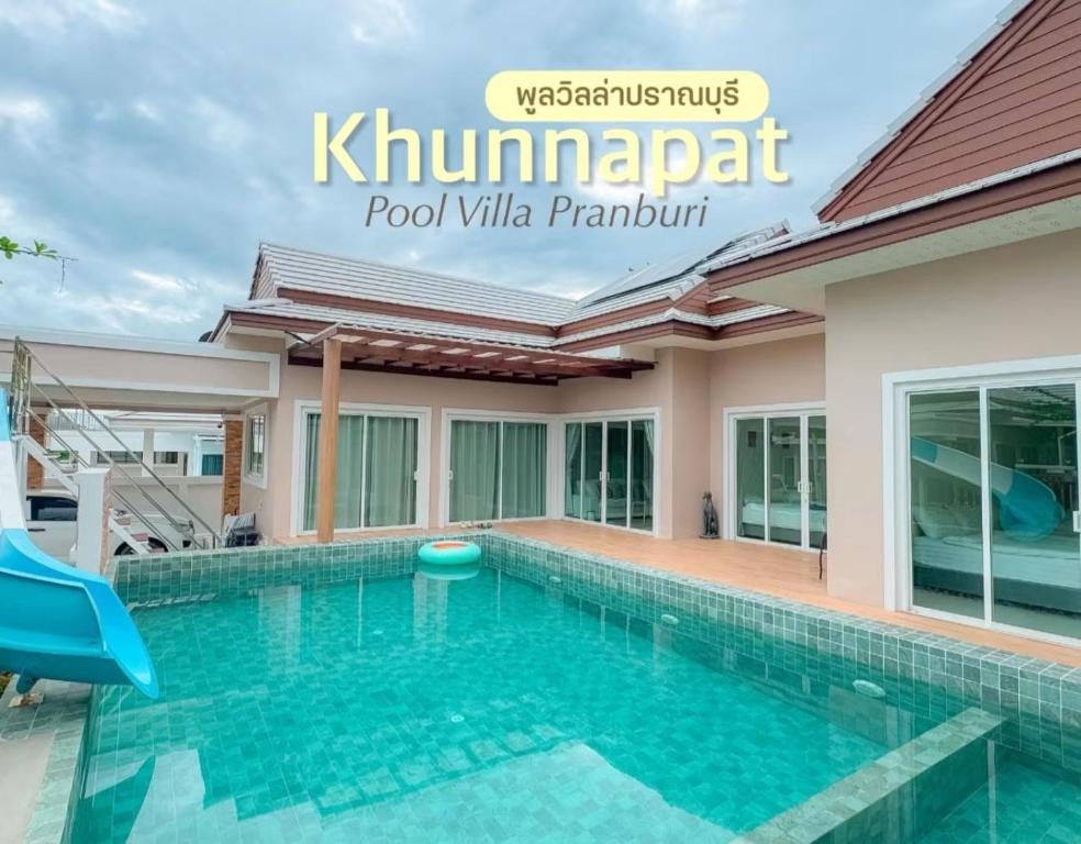 a villa with a swimming pool in kalamaprabari pool villa at Khunnapat Pool Villa Pranburi in Ban Huai Thalaeng Phan