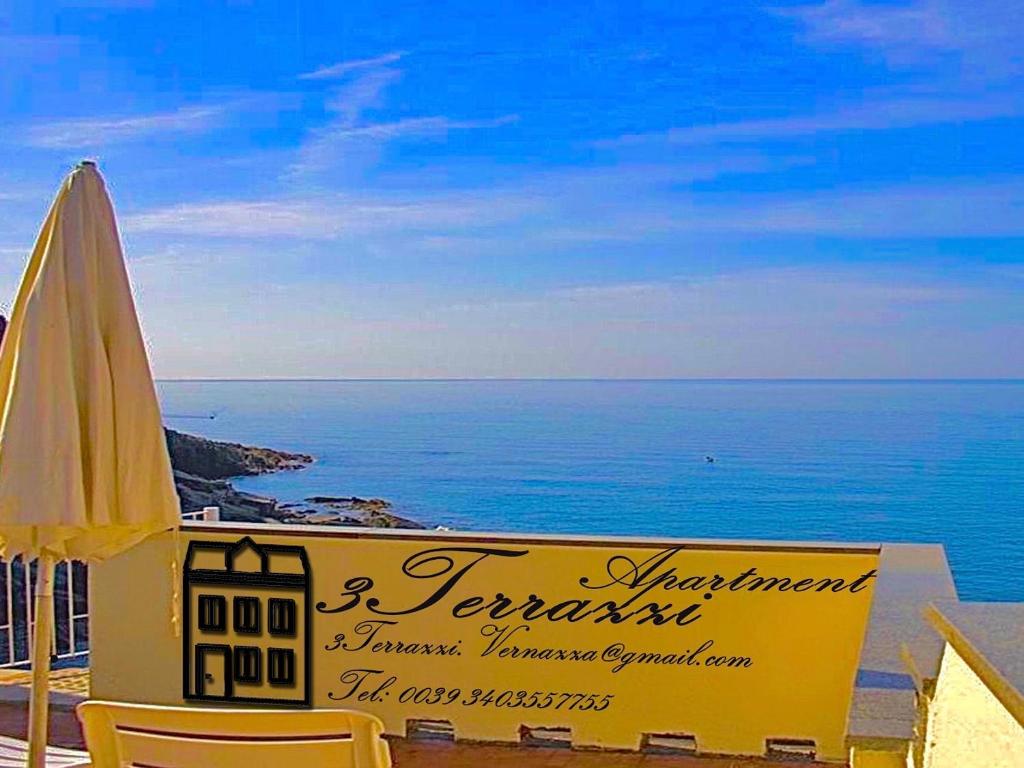 a sign for a restaurant next to the ocean at Families or Groups 3 Terrazzi Penthouse on Sea w Ac in Vernazza