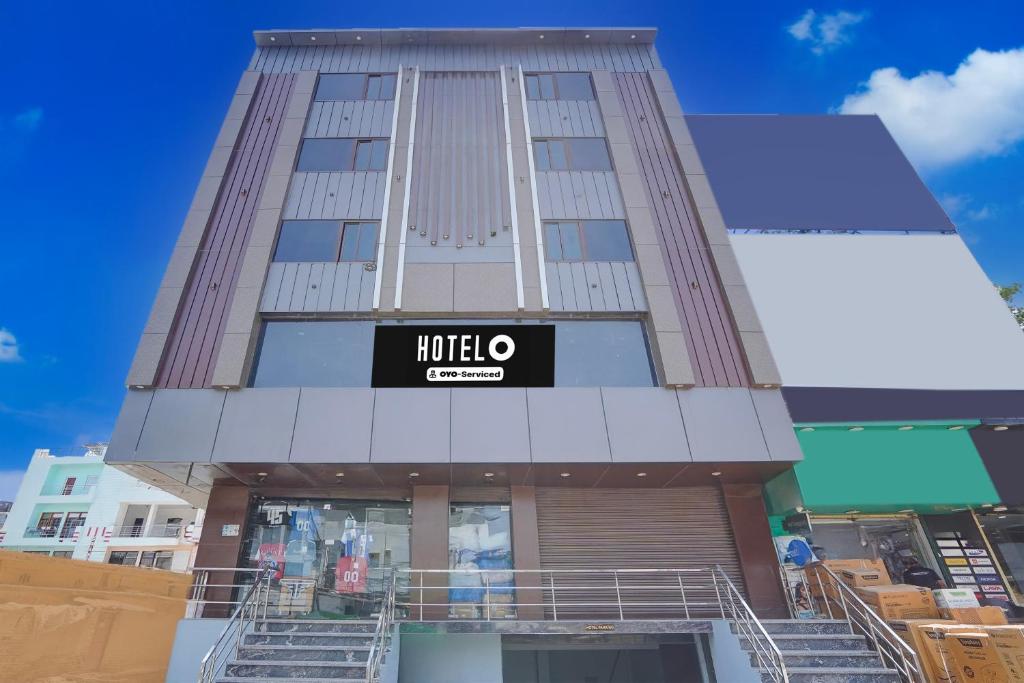 a building with a mitto center sign on it at Hotel O by OYO S R Galaxy in Kānpur