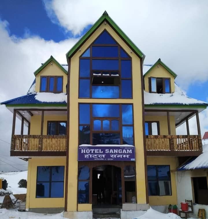 a hotel with a sign on the front of a building at Hotel sangam kalinchok kuri in Dolakhā