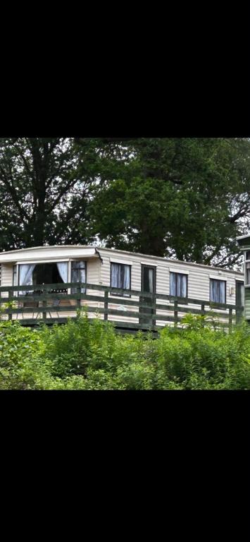 a house with a fence in front of it at 48 River View in Dunoon