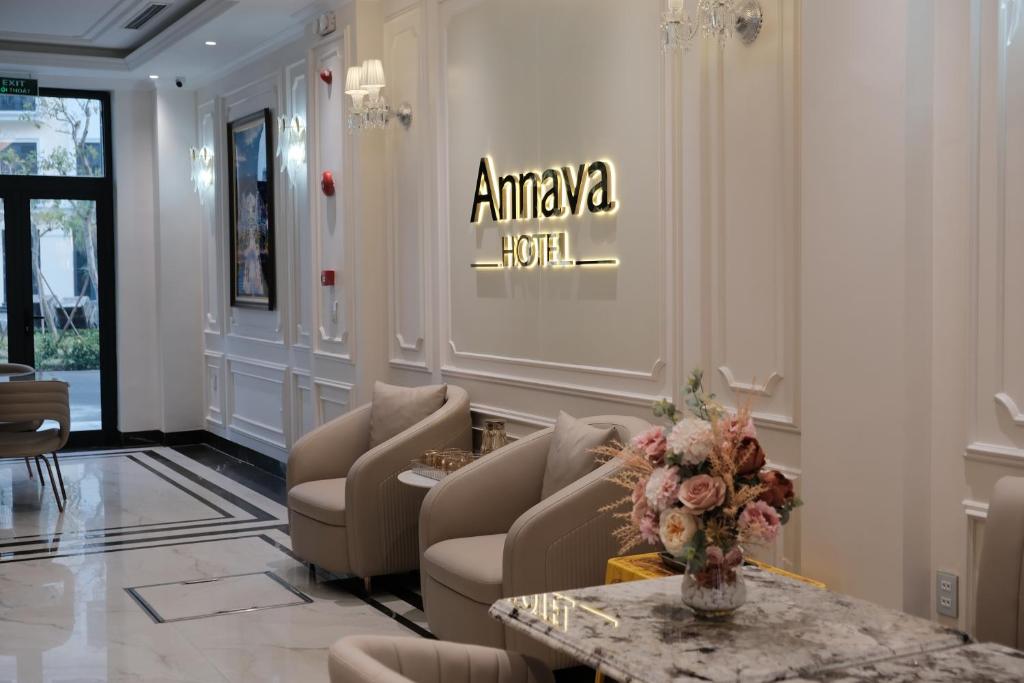 a lobby with couches and a table and a sign at Annava Hotel & Coffee in Hai Phong
