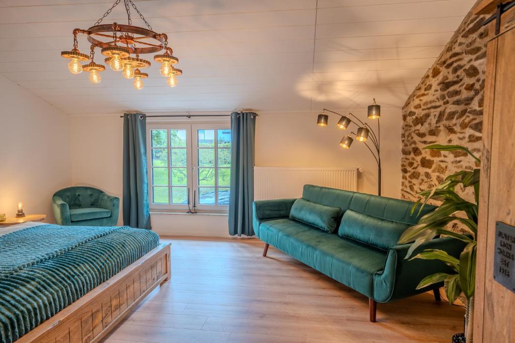a living room with a couch and a bed at Starkenburger Perle in Starkenburg
