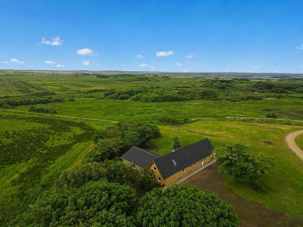 an overhead view of a house in the middle of a field at 80324-Ulfborg-Munkhulevej-6 in Staby