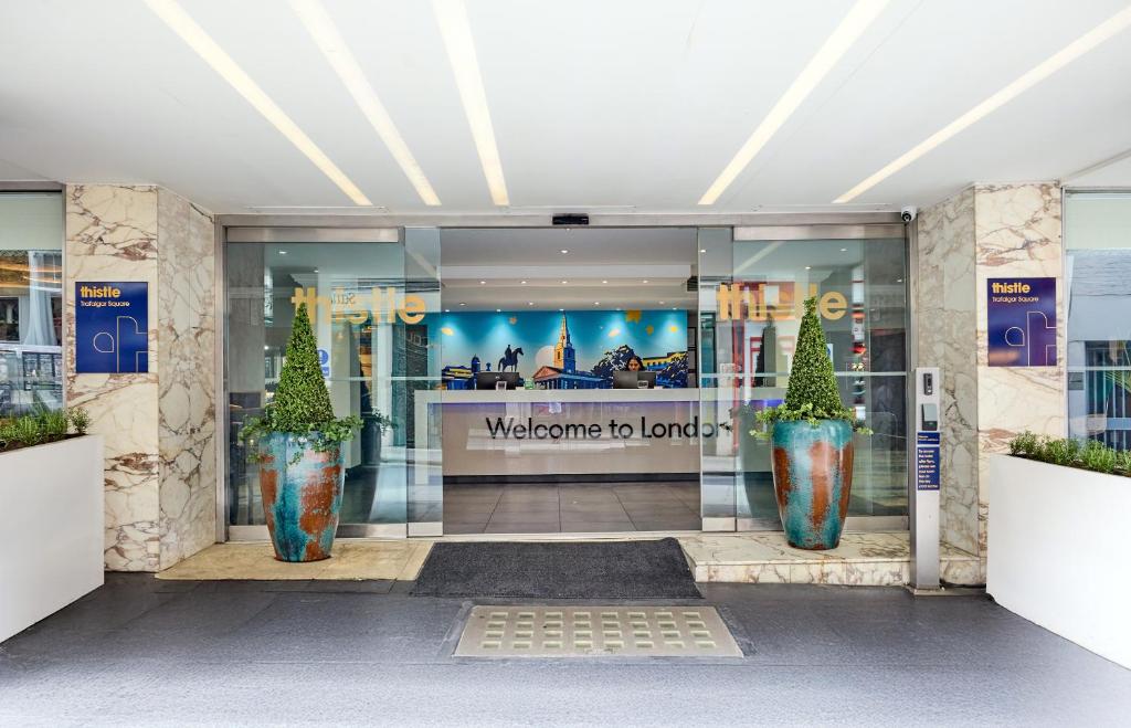 a store front with two large vases in the door at Thistle Trafalgar - Leicester Square in London