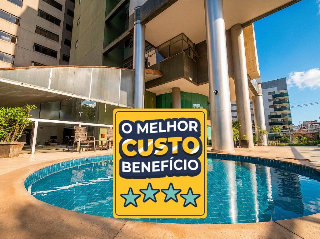 a sign in front of a swimming pool at Village Savassi in Belo Horizonte