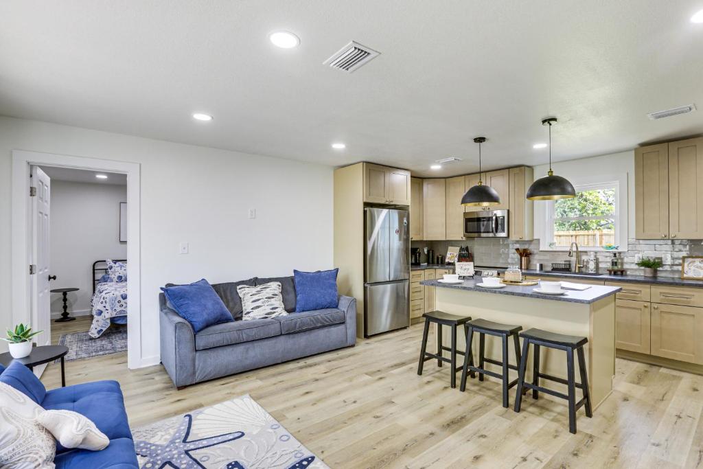 a kitchen and living room with a couch and a table at Steinhatchee River Hideaway, 1 Mi to the Water! in Steinhatchee