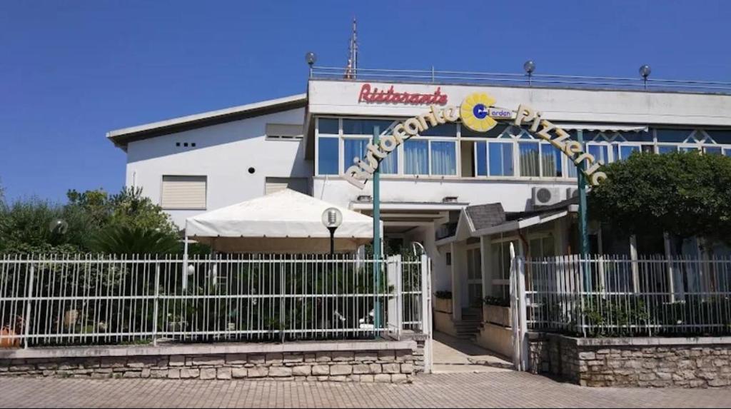 a roller coaster in front of a building at Little Garden in Formia